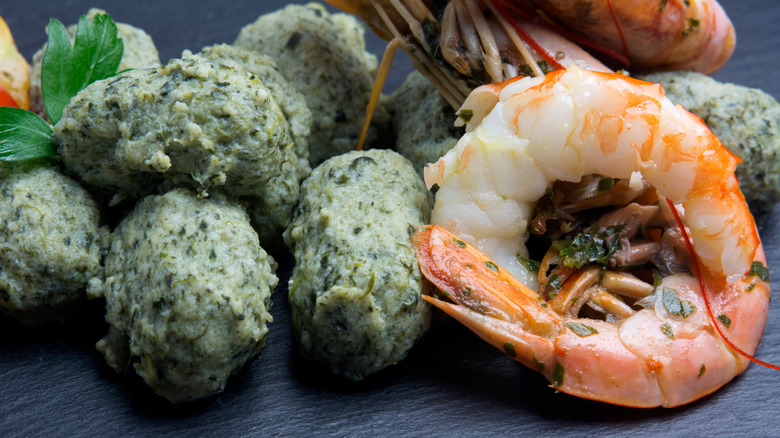 Gnudi with shrimp on plate