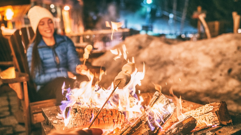 roasting marshmallows over flame