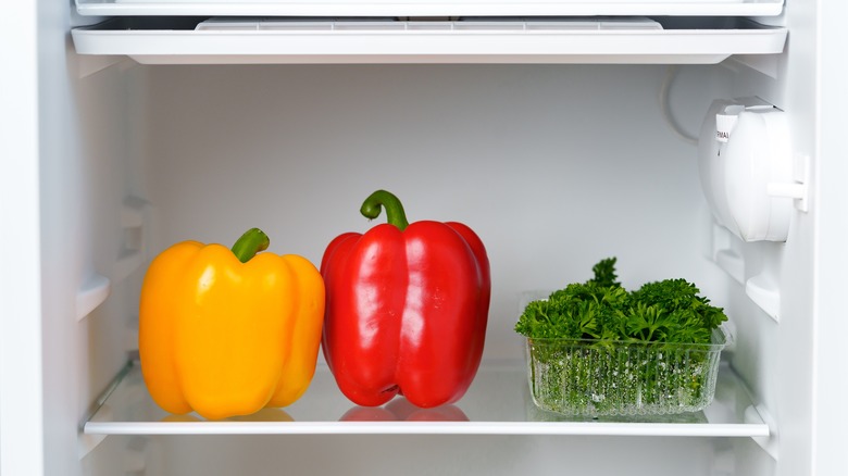 Bell peppers, herbs in fridge