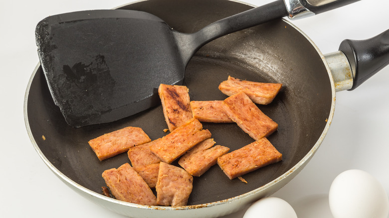 Spam in skillet with eggs