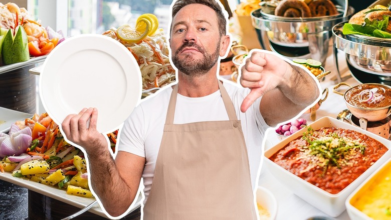 Man holding a buffet plate with a thumb down