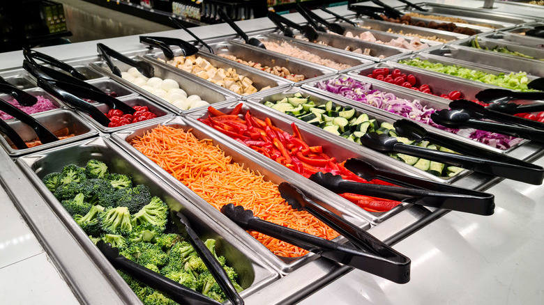 Many trays of buffet food