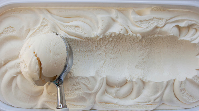 Scooping vanilla ice cream