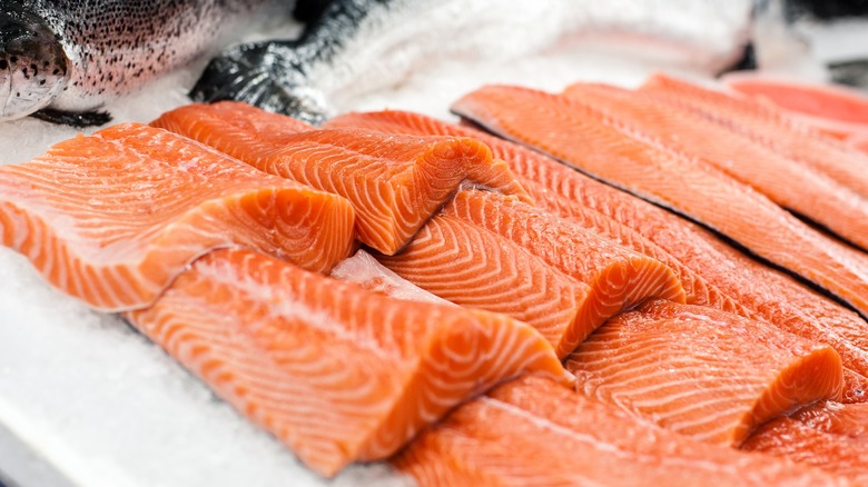 raw salmon fillet on wood