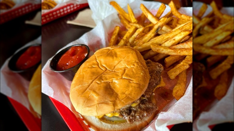 Burger in a tray with fries and ketchup from Dyer's