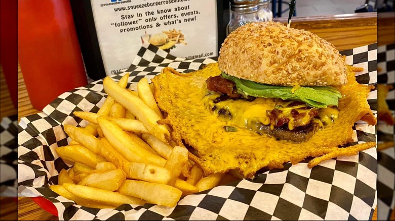 Squeeze Burger with Cheese Skirt in a basket on table