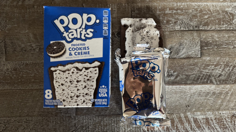 Cookies and creme Pop-Tart box next to unwrapped pop-tart