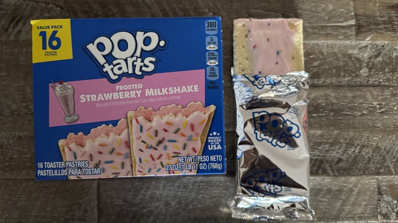 Frosted strawberry milkshake Pop-Tarts next to unwrapped pop-tart