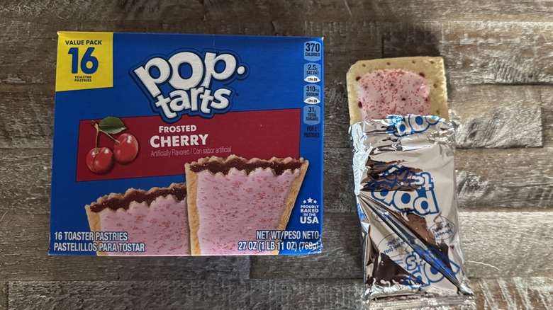 Frosted cherry Pop-Tart box next to unwrapped pop-tart