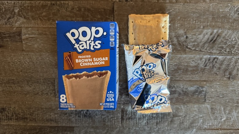 Frosted brown sugar cinnamon Pop-Tart box next to unwrapped pop-tart