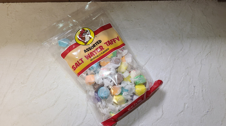 Bag of  Buc-ee's assorted salt water taffy on white table