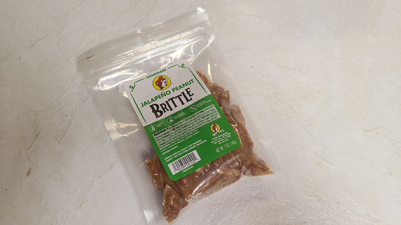 Package of Buc-ee's peanut brittle on white table