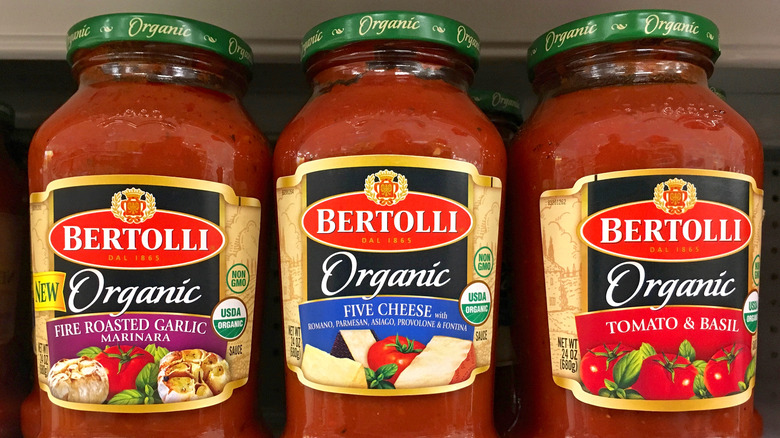 three bertolli sauce jars