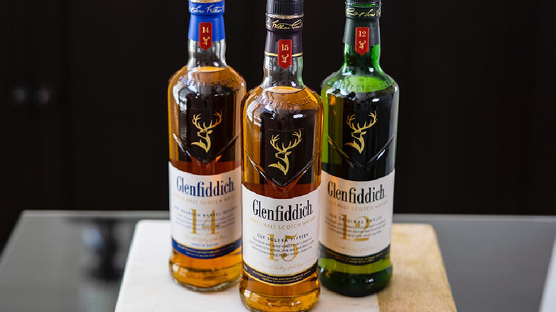 three bottles of Glenfiddich scotch