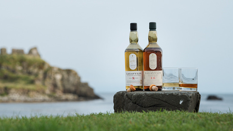Lagavulin 8 and 16-Year bottles by ocean