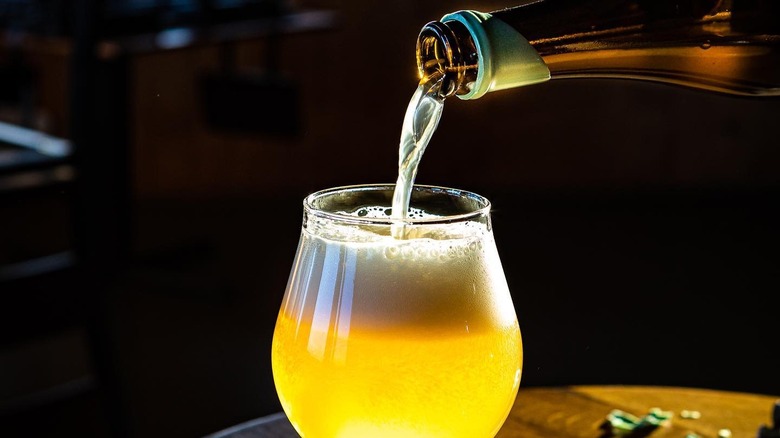 Pouring Allagash beer into glass