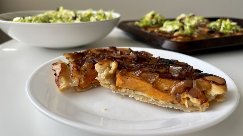 Halved onion tart on plate