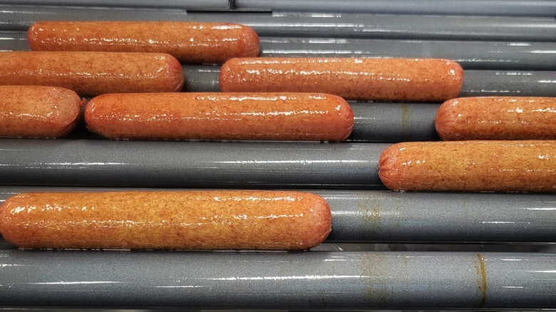 Hot dogs on heated roller