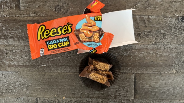 Reese's caramel big cup candy on wooden surface