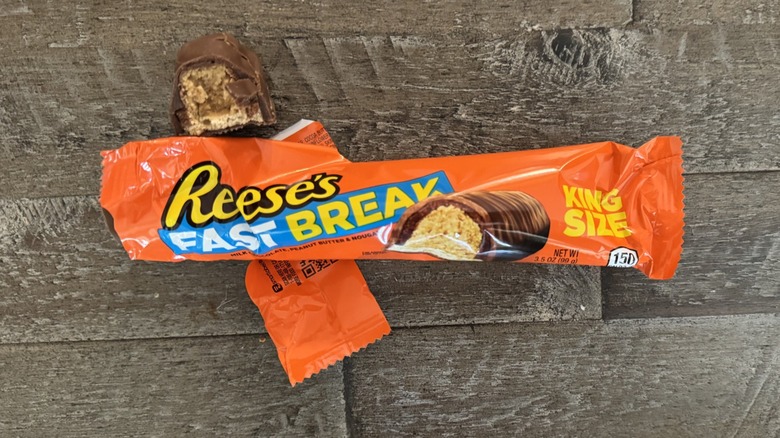 Reese's Fast Break candy bar on wooden surface