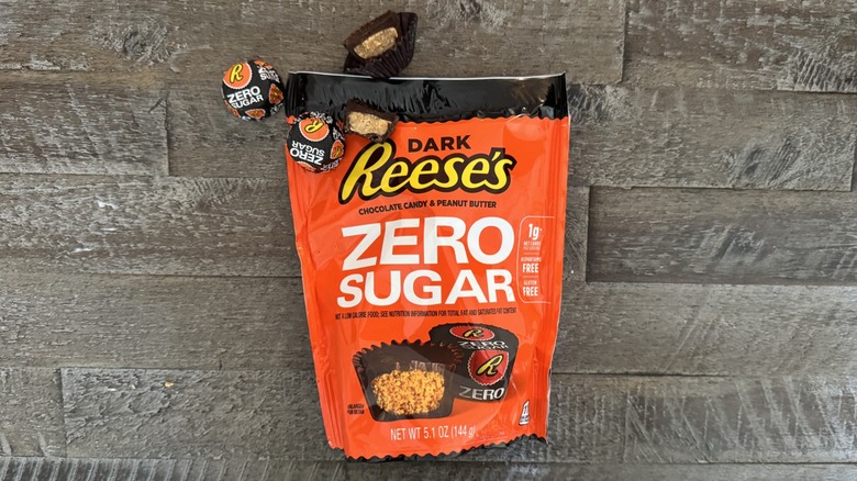 Dark chocolate zero-sugar Reese's cups on wooden surface