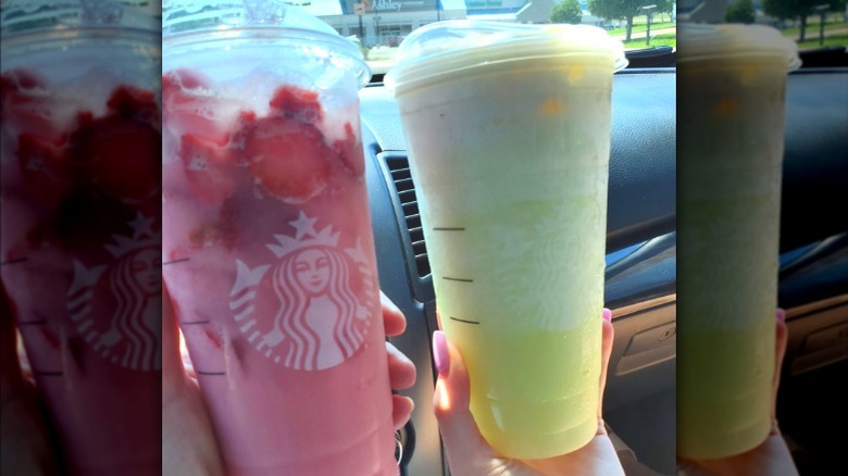 Holding two Starbucks drinks