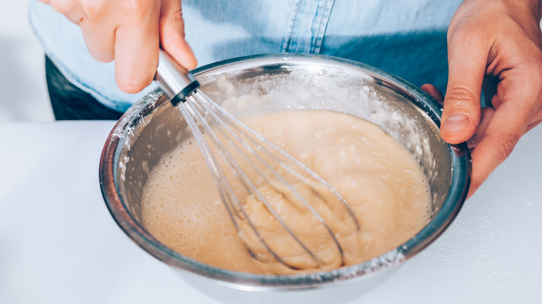 Mixing batter with whisk