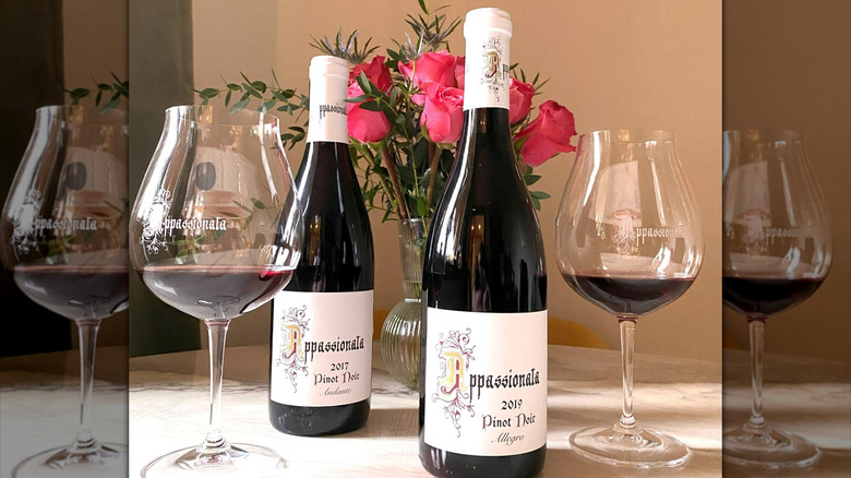 Two bottles of Appassionata Estate Allegro pinot noir with two glasses