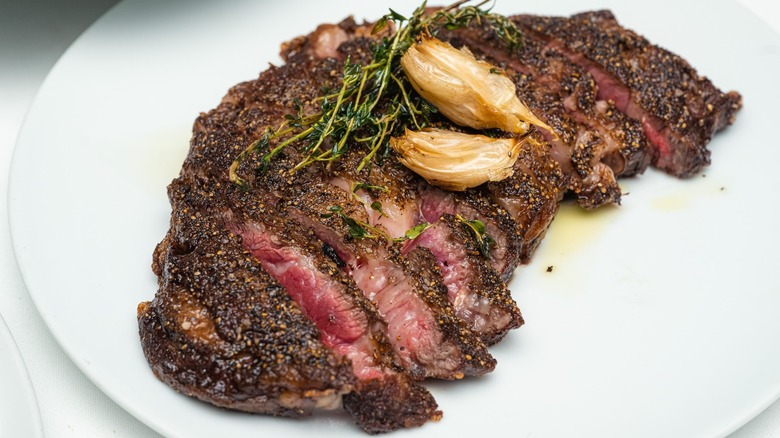 Plated seasoned cast iron ribeye