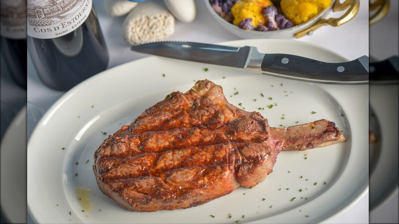 Plated bone-in ribeye steak