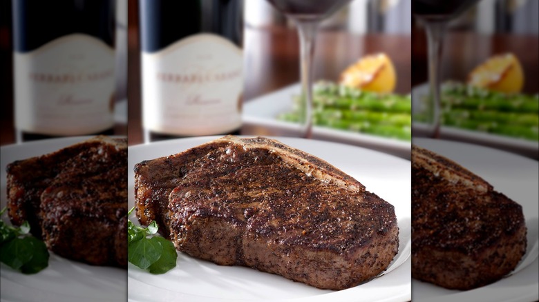 Seasoned steak on white plate