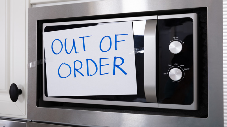 Microwave with out of order sign on the front