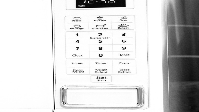 Closeup of microwave clock and preset buttons