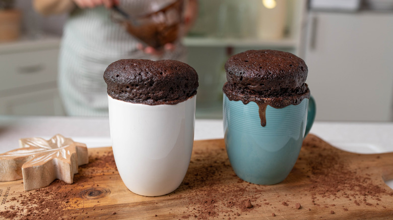 Two microwave mug cakes on counter