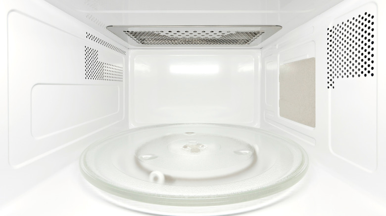 Empty, white microwave interior