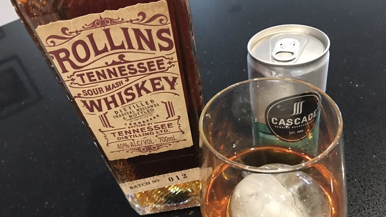 Rollins whiskey with poured glass