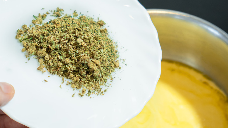 Cannabis grounds into butter