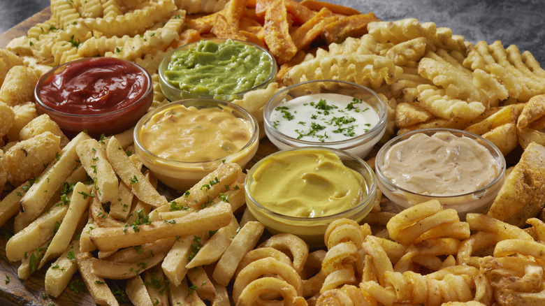 French fry platter with various dipping sauces