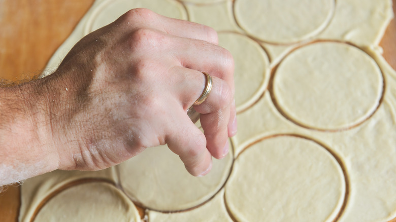 Cutting pierogi dough with glass