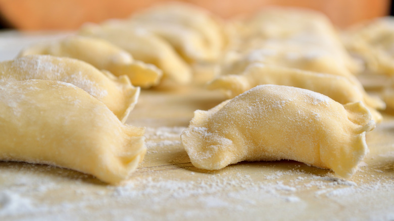 Shaped stuffed pierogis on counter