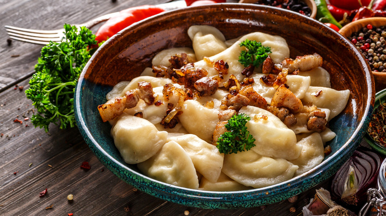 Pierogis in bowl with onion