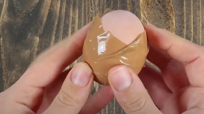 Packing tape wrapped around an egg