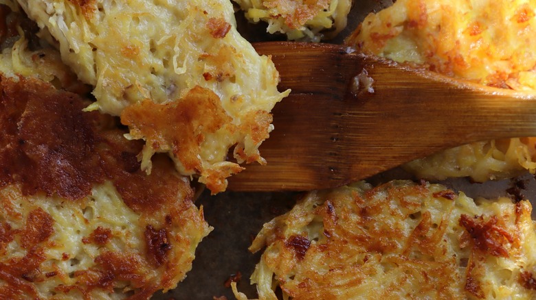 Flipping hash brown wooden spoon