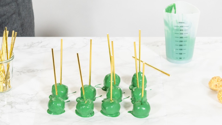 dipped cake pops drying