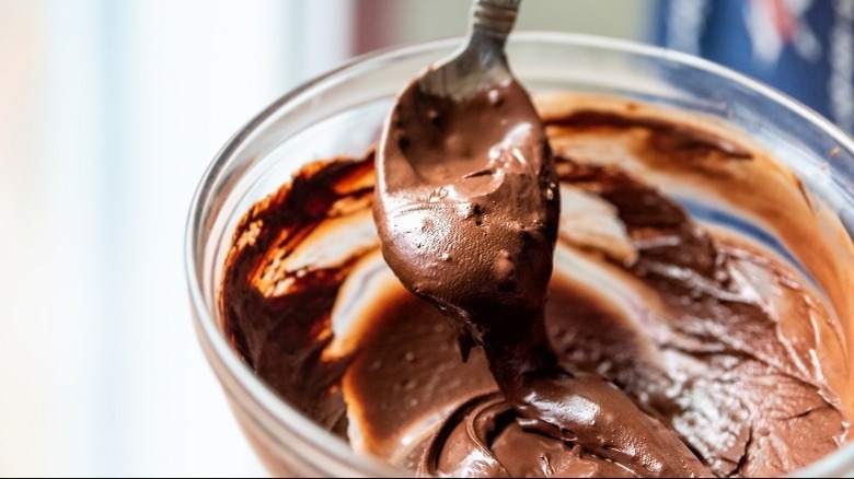 Spoon in melted chocolate