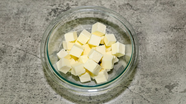 Butter cubes in a cup