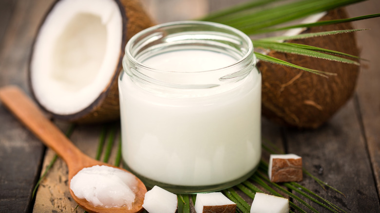 Coconut oil with coconuts jar