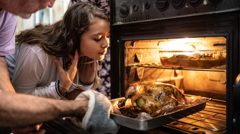 putting chicken in oven