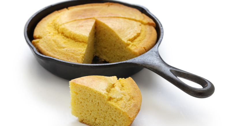 Cornbread sliced in skillet