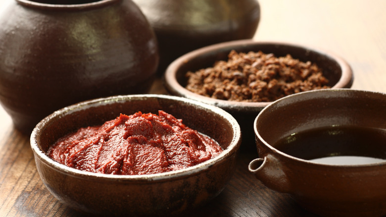 clay brown bowls red chile paste soy sauce